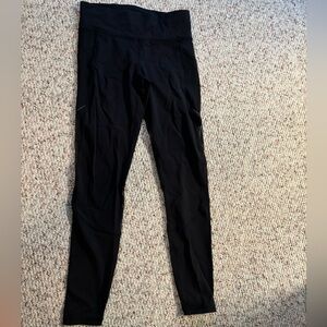 Lululemon legging - with pockets and tight material on back of leg.